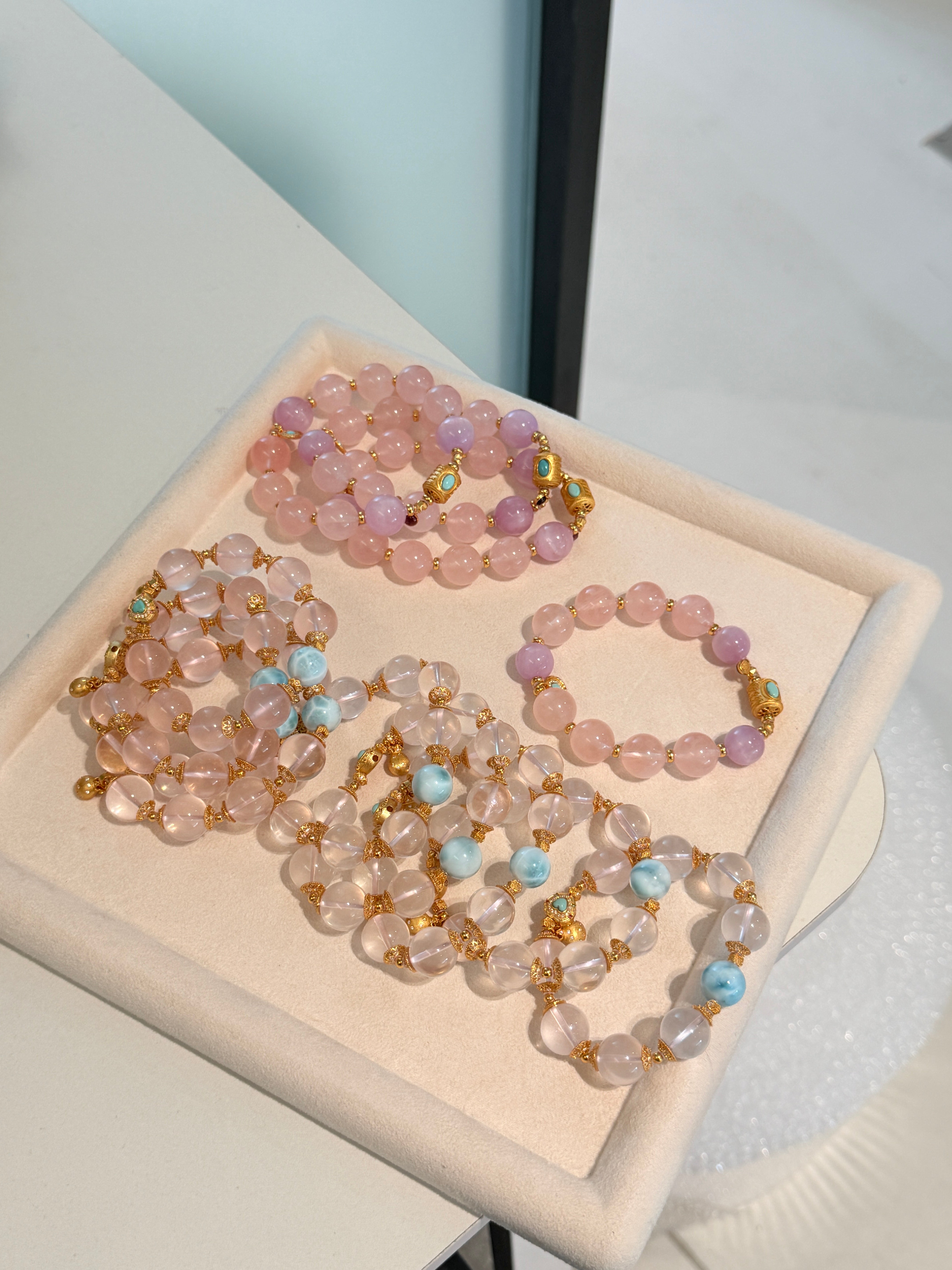 Elysian Jewelry set of beaded bracelets on a white box with a light background