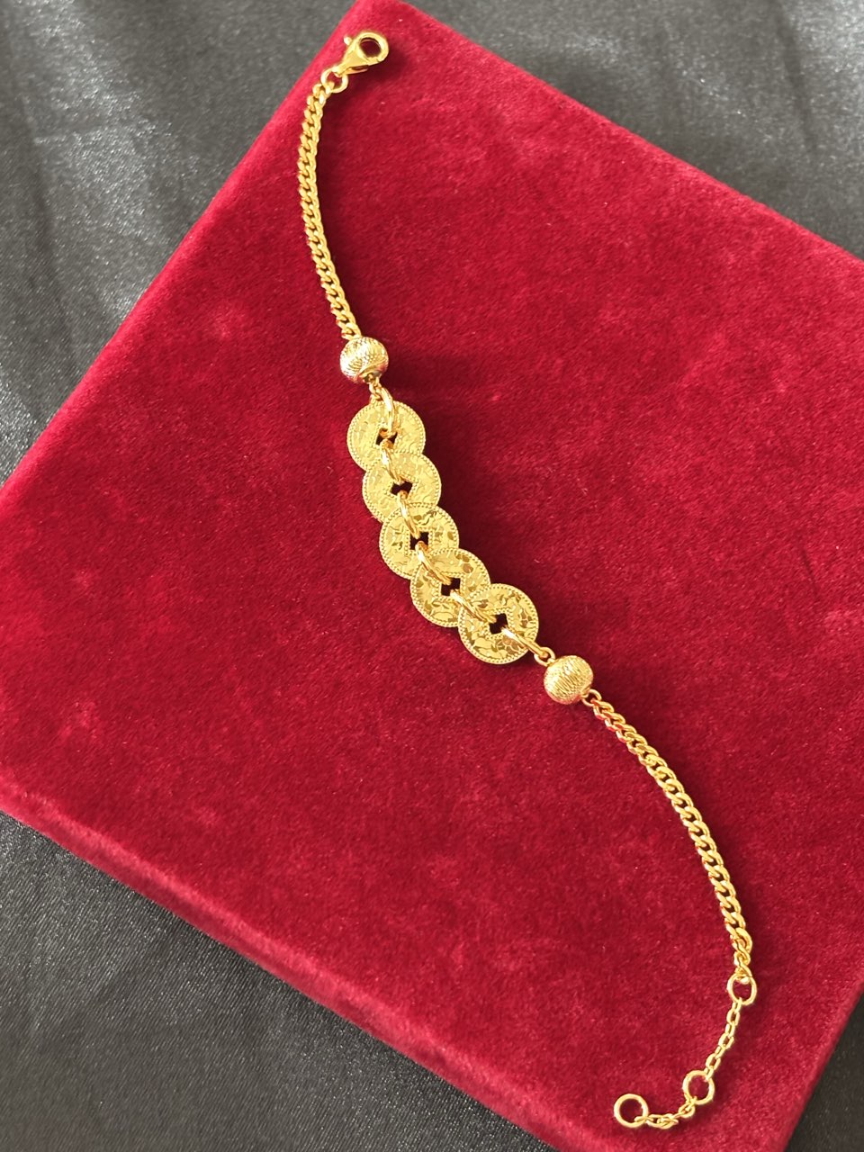 Elysian jewelry 925 silver with 18k plated gold bracelet on a red velvet surface