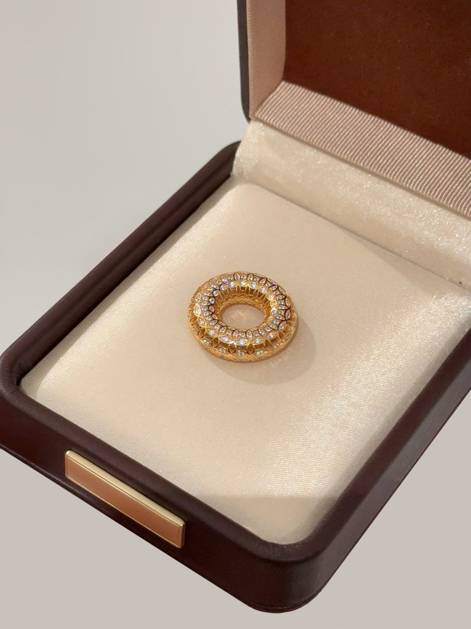 Elysian Jewelry 925 silver with 18k plated gold pendant with diamonds in a brown jewelry box on a light gray background